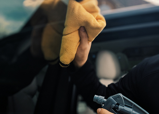 Eric cleaning vehicle windows.